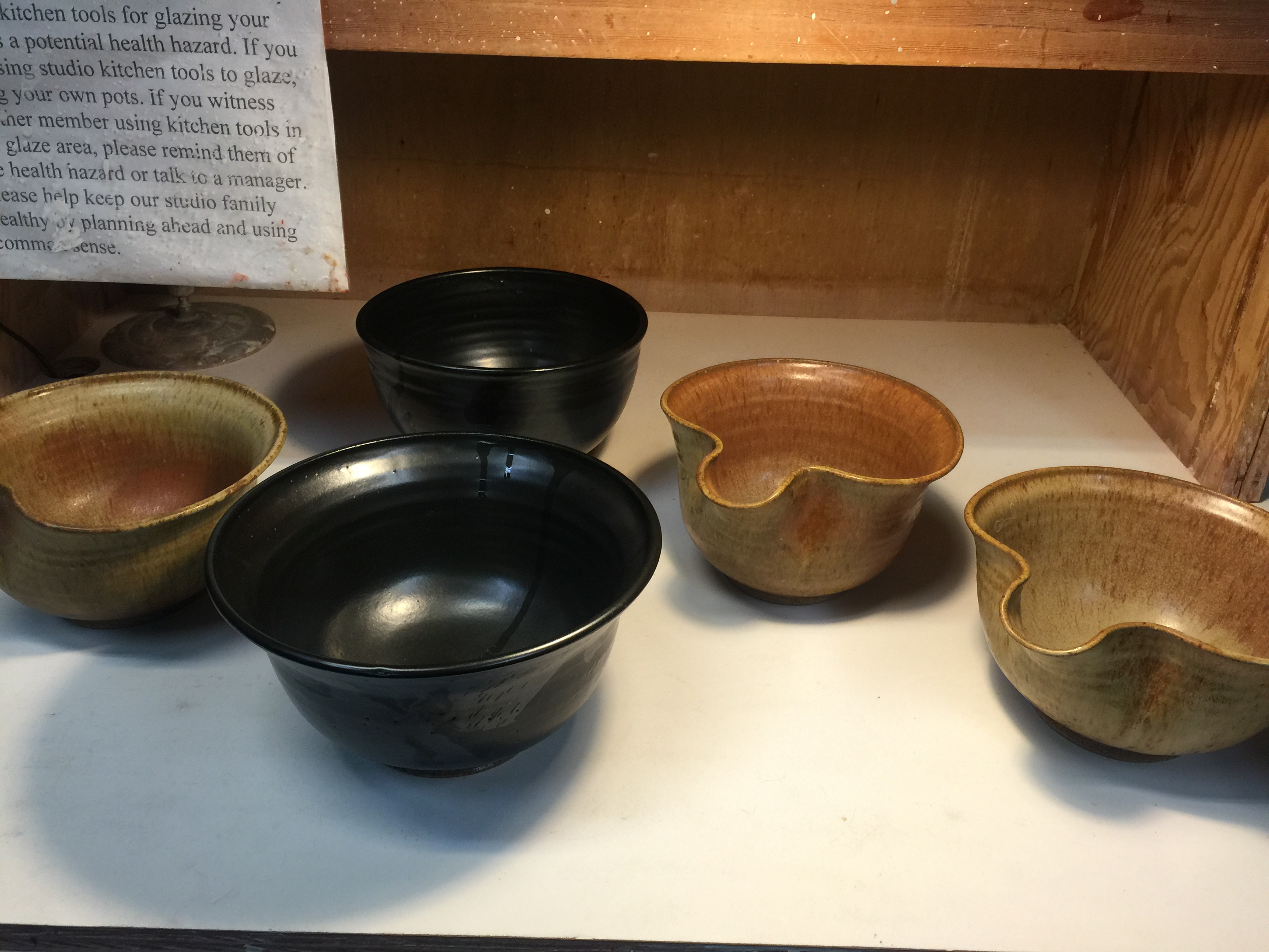 Ceramic bowls with black and earth-toned glazes