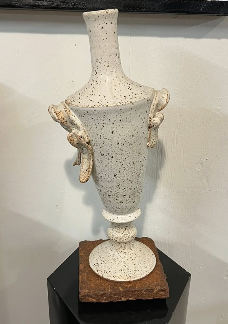 Speckled white ceramic urn