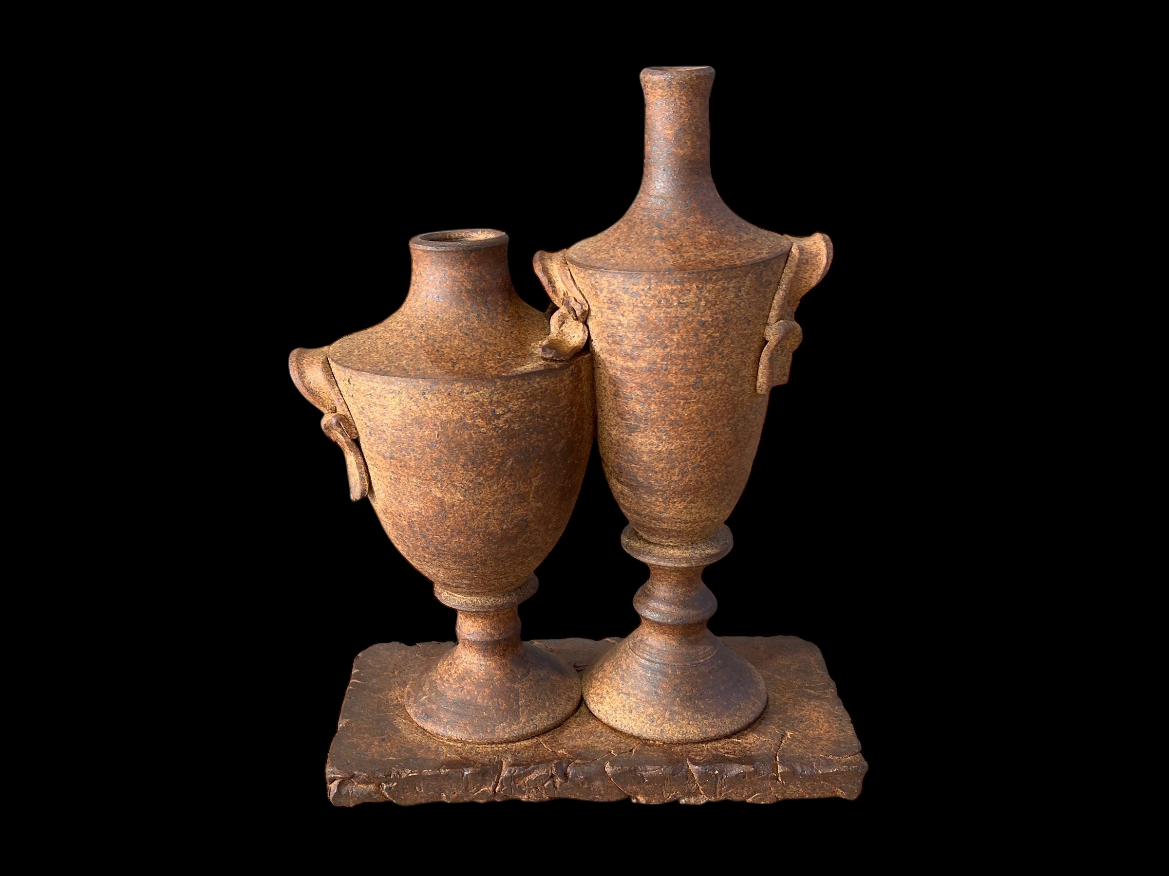 Rustic urn pair on shared base