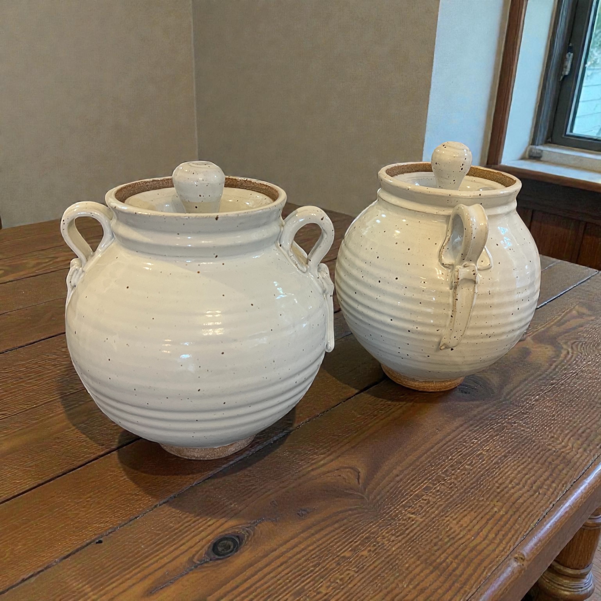 White speckled lidded jars with handles