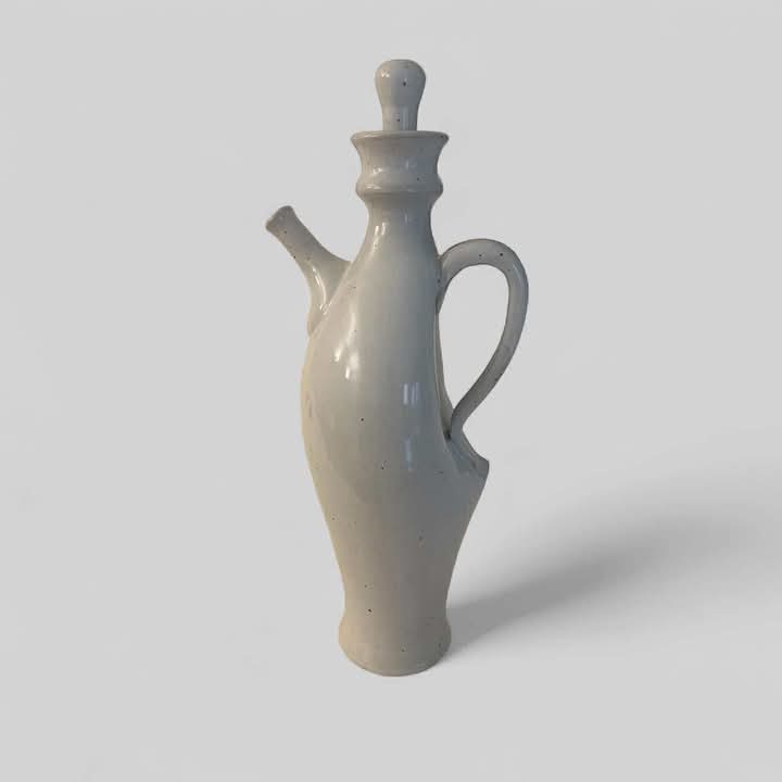White ceramic ewer with stopper